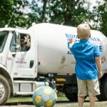Bumgarner Propane truck driver waving to family
